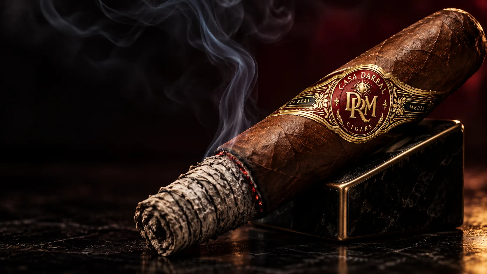 A CASA DAREAL cigar resting on a black marble stand, a long layered ash at its tip and a burgundy and gold DRM band near the head.